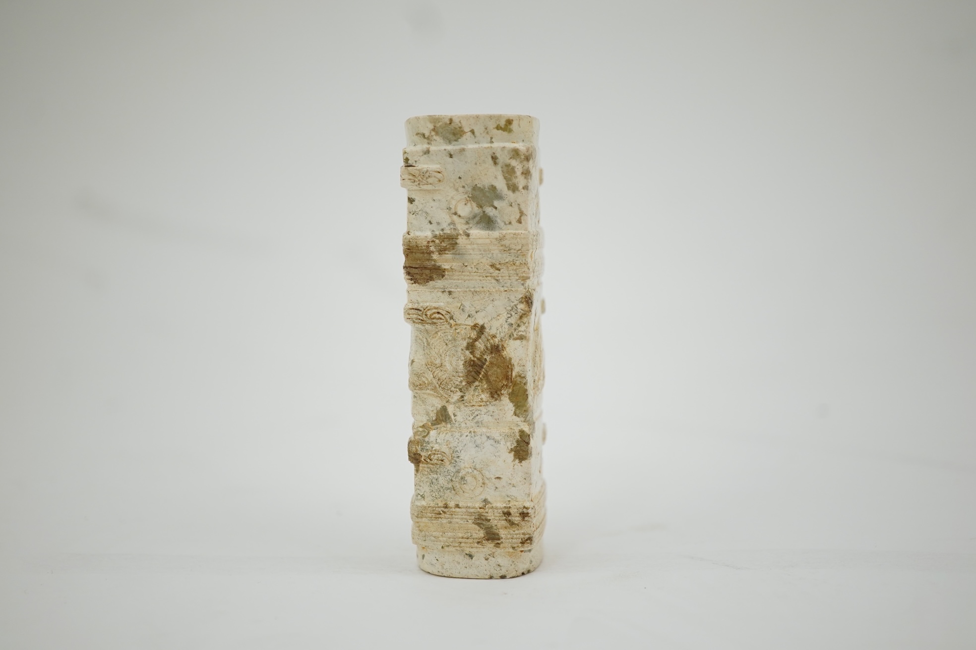 Four Chinese archaistic hardstone or burnt jade cong or cylinders